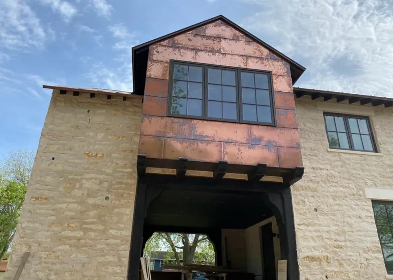 Copper metal panel facade on a stone building for Skylight Installation in Tarrytown